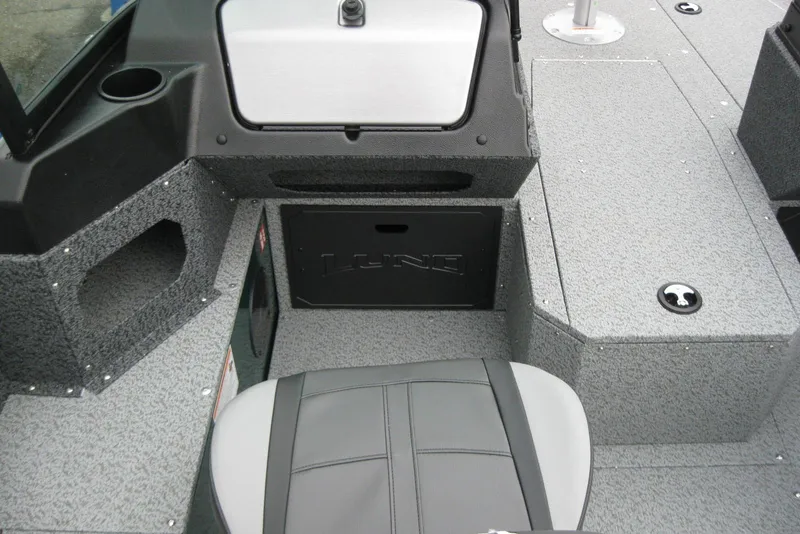 Slide: The Image of 2026 Lund 1700 Explorer Sport boat interior with gray seating and storage compartments. - 14
