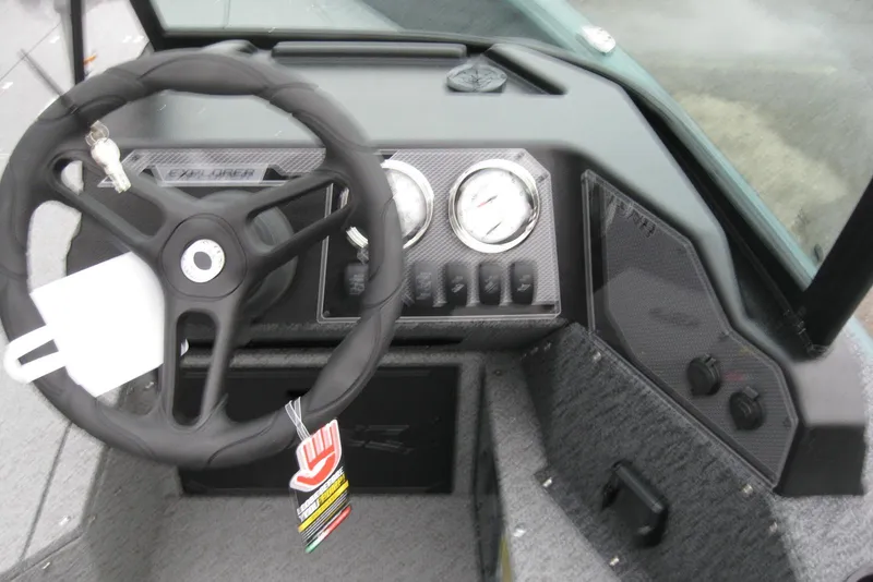 Slide: The Image of Steering console of 2026 Lund 1700 Explorer Sport boat with gauges and controls. - 16