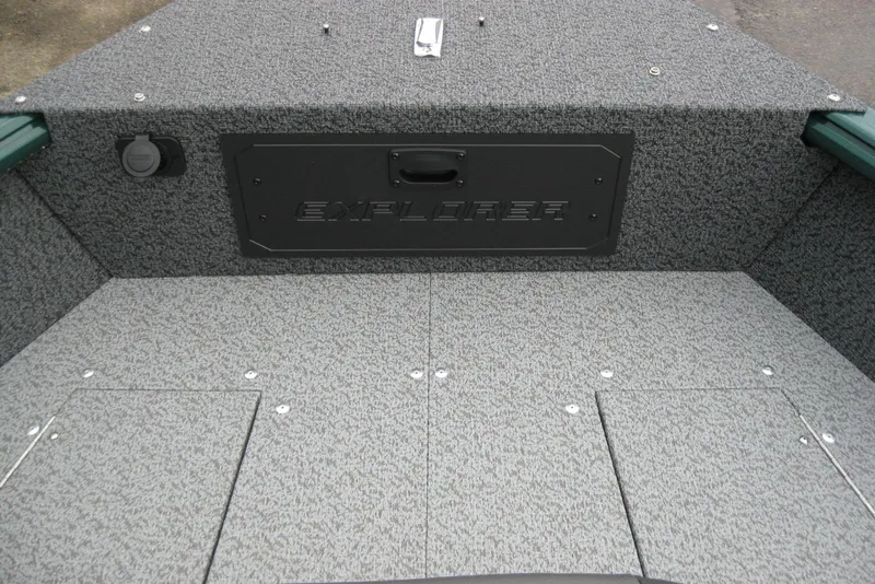 Slide: The Image of 2026 Lund 1700 Explorer Sport boat interior with textured flooring and storage compartments. - 19