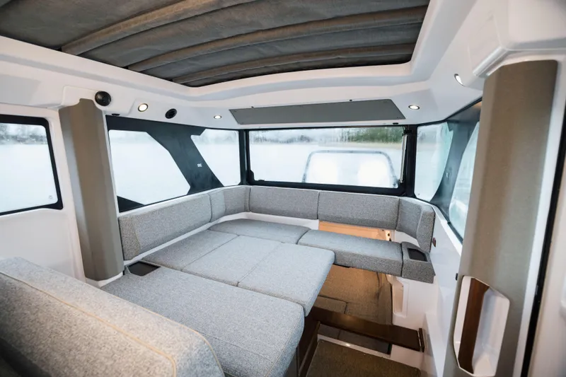 Slide: The Image of Interior of 2026 Axopar 38 Cross Cabin with modern seating and dashboard. - 13