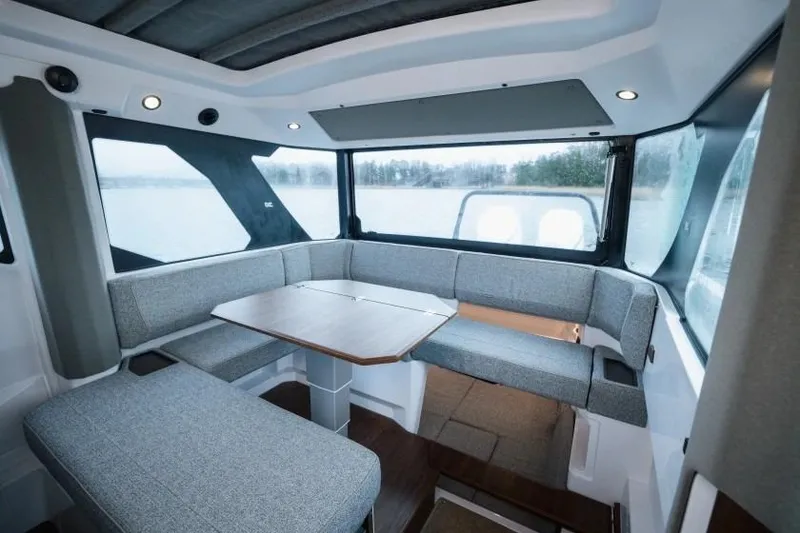 Slide: The Image of Luxurious interior of 2026 Axopar 38 Cross Cabin with modern seating and panoramic windows. - 14