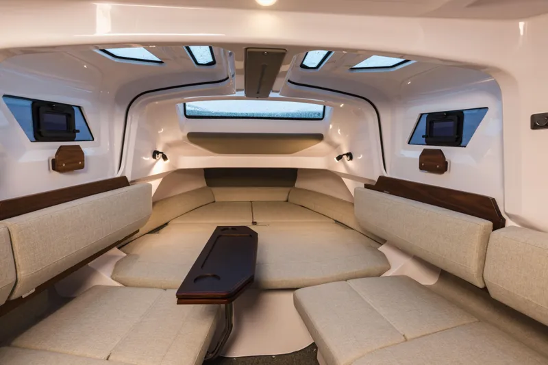 Slide: The Image of Luxurious interior of 2026 Axopar 38 Cross Cabin with modern seating and skylights. - 21