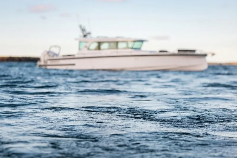 Slide: The Image of 2026 Axopar 38 Cross Cabin boat with innovative features and spacious design. - 24