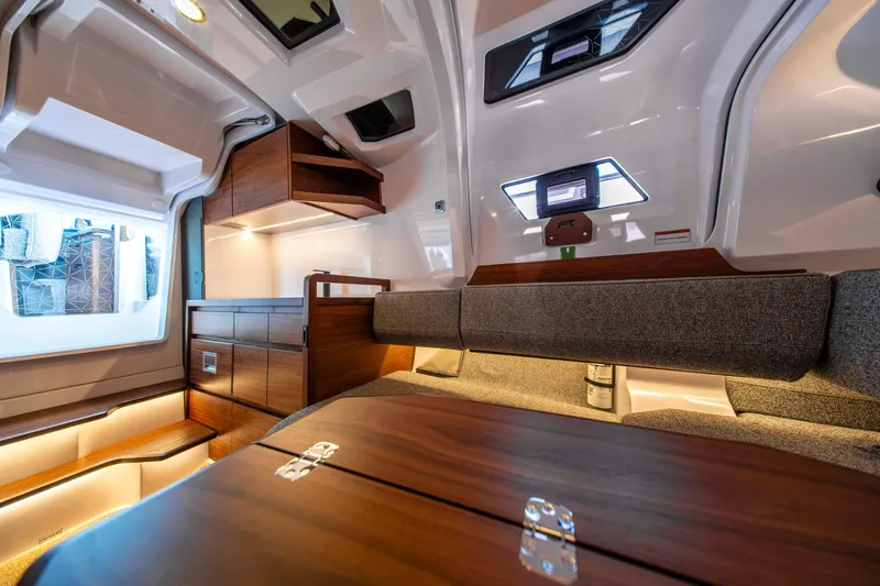 Slide: The Image of Luxurious interior of 2026 Axopar 38 Cross Cabin with modern wood finishes and ambient lighting. - 29
