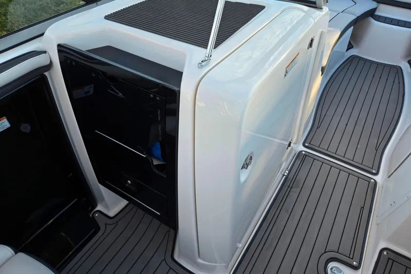 Slide: The Image of 2017 Yamaha Boats 242 Limited S E-Series interior with sleek deck design. - 13