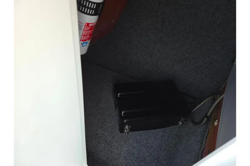 Slide: The Image of Interior of 2017 Yamaha 242 Limited S E-Series boat with fire extinguisher. - 16