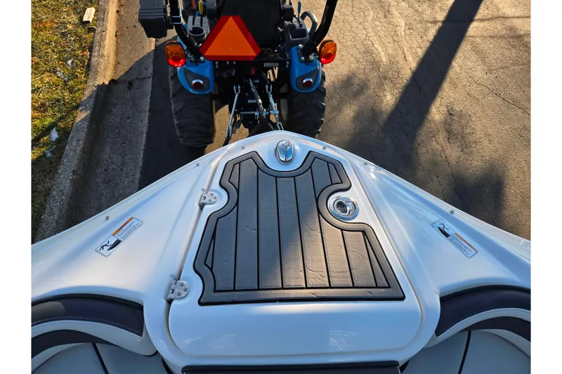 Slide: The Image of 2017 Yamaha Boats 242 Limited S E-Series bow, parked on a street. - 18