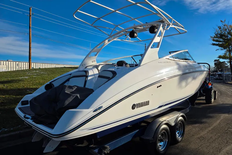 Slide: The Image of 2017 Yamaha Boats 242 Limited S E-Series on trailer, sleek design under clear sky. - 3