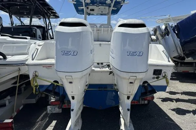 Slide: The Image of 2015 Sea Hunt Gamefish 25 with twin 150 horsepower outboard engines. - 2