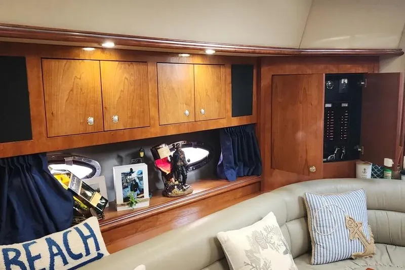 Slide: The Image of Interior of 2005 Cruisers Yachts 440 Express with wooden cabinets and nautical decor. - 10
