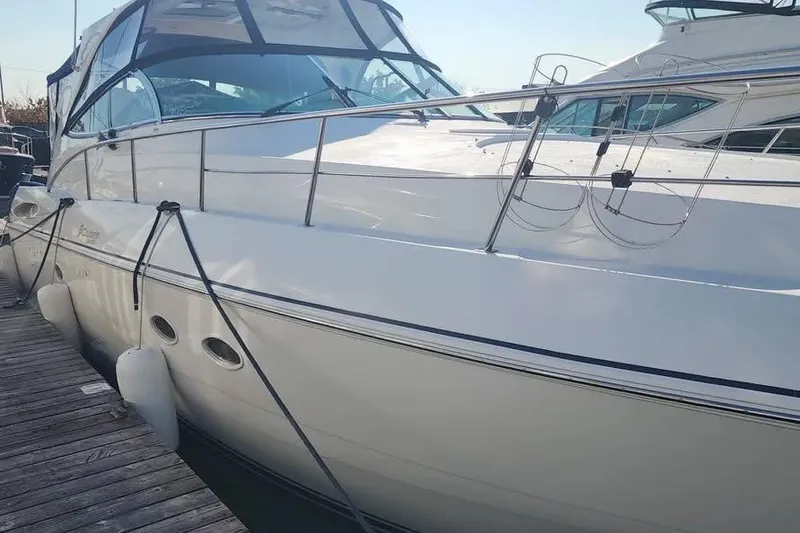 Slide: The Image of 2005 Cruisers Yachts 440 Express docked, showcasing sleek design and modern features. - 3