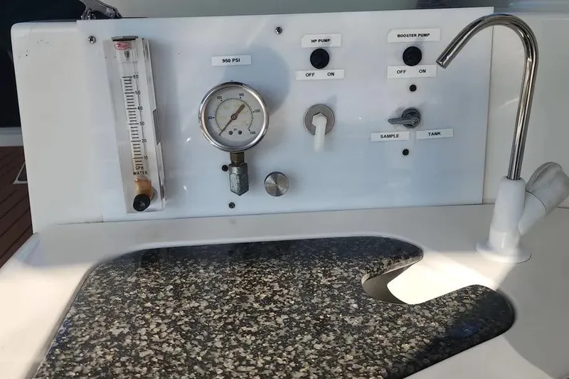 Slide: The Image of Control panel on 2005 Cruisers Yachts 440 Express with pressure gauge and switches. - 8