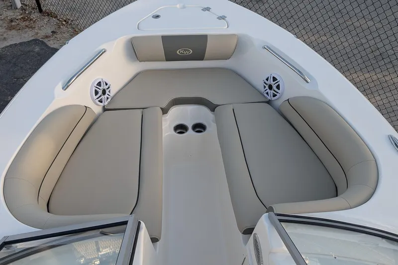 Slide: The Image of Bow seating area of 2026 Key West 203 DFS boat with beige cushions and speakers. - 18