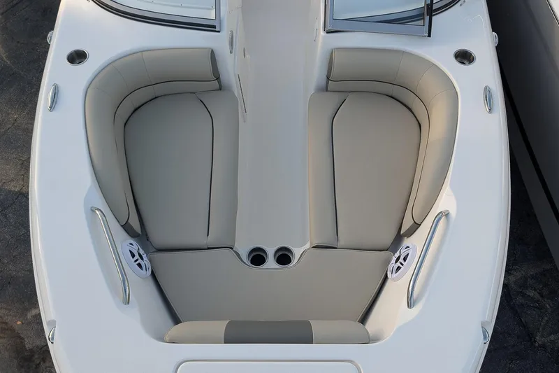 Slide: The Image of 2026 Key West 203 DFS boat interior with cushioned seating and cup holders. - 19