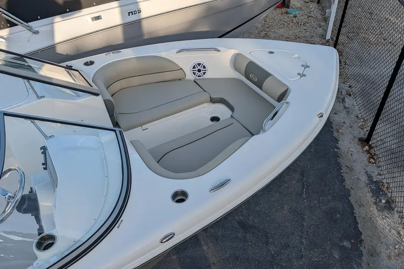 Slide: The Image of Bow seating area of 2026 Key West 203 DFS boat with cushioned seats and speaker. - 5