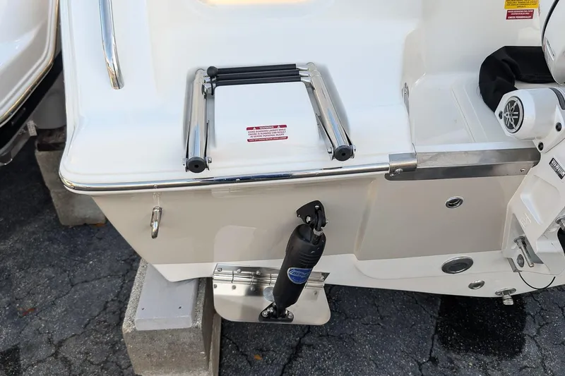 Slide: The Image of 2026 Key West 203 DFS boat stern with ladder and motor details. - 7