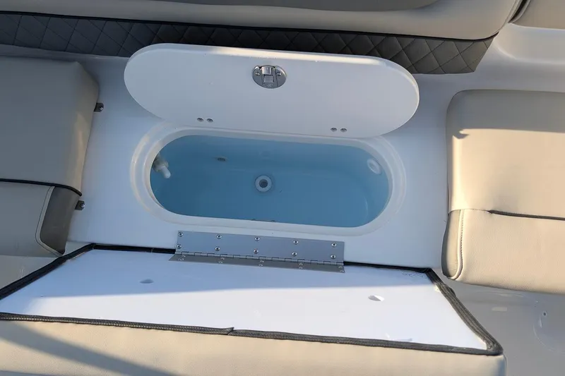 Slide: The Image of 2026 Key West 203 DFS boat interior with open storage compartment. - 9