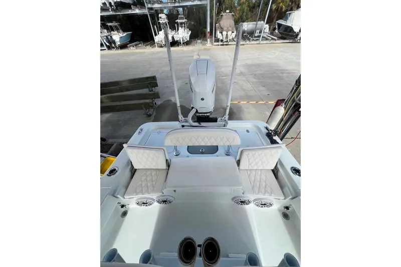 Slide: The Image of 2025 Contender 26 Bay boat interior with cushioned seating and modern design. - 10