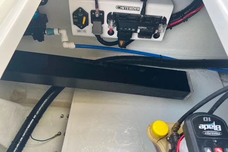 Slide: The Image of 2025 Contender 26 Bay boat wiring and control panel with Garmin system. - 24