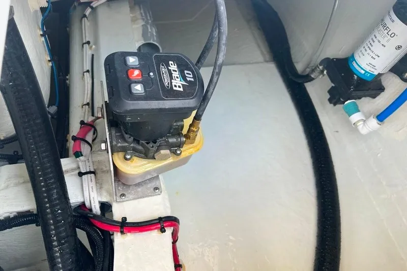 Slide: The Image of 2025 Contender 26 Bay boat interior with wiring and hydraulic components. - 25