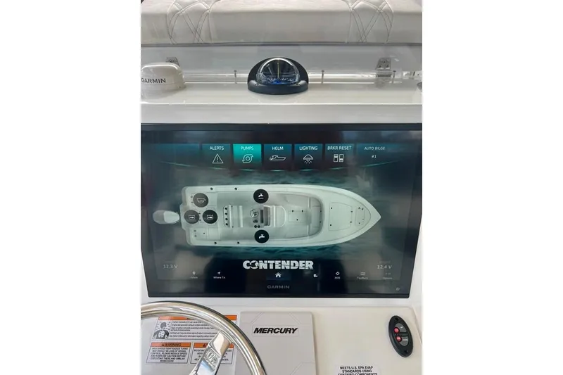Slide: The Image of 2025 Contender 26 Bay boat dashboard with Garmin display and Mercury controls. - 4