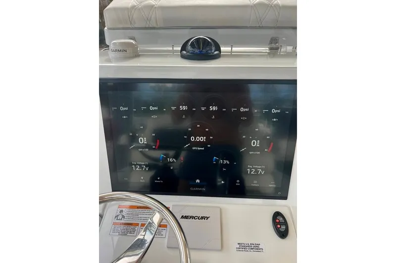 Slide: The Image of Dashboard of 2025 Contender 26 Bay boat with Garmin display and Mercury controls. - 6