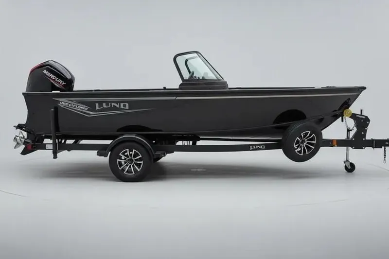 The Image of 2026 Lund 1800 Explorer Sport boat on trailer, side view, with Mercury engine. - 0