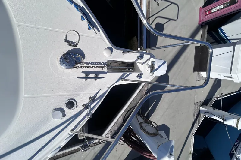 Slide: The Image of Bow of 2006 Wellcraft 290 Coastal boat with anchor and railing at dock. - 25