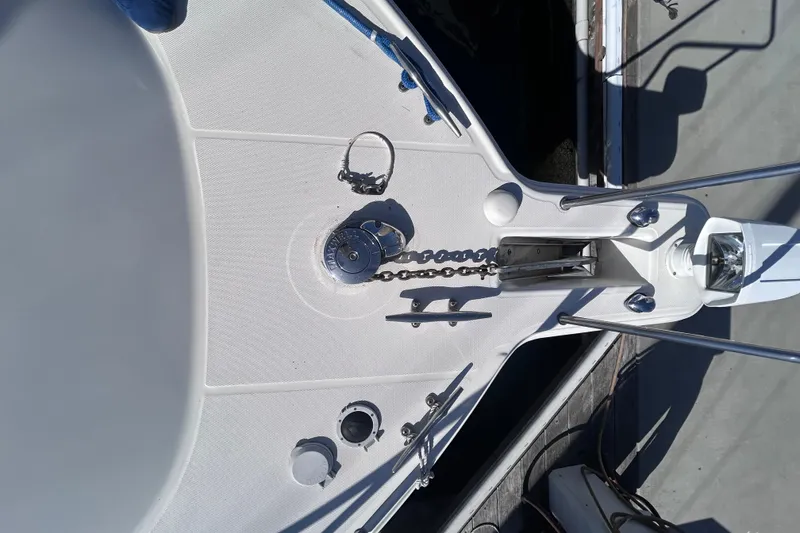 Slide: The Image of 2006 Wellcraft 290 Coastal boat deck with anchor chain and winch. - 26
