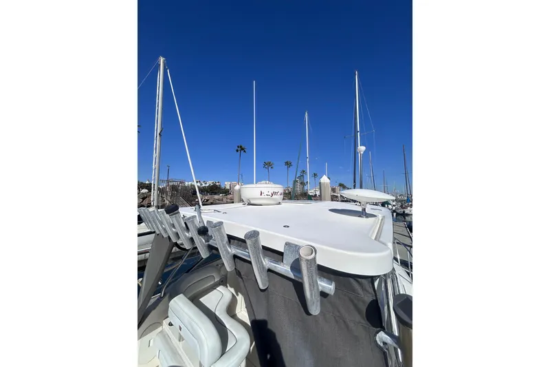 Slide: The Image of 2006 Wellcraft 290 Coastal boat docked under clear blue sky. - 31