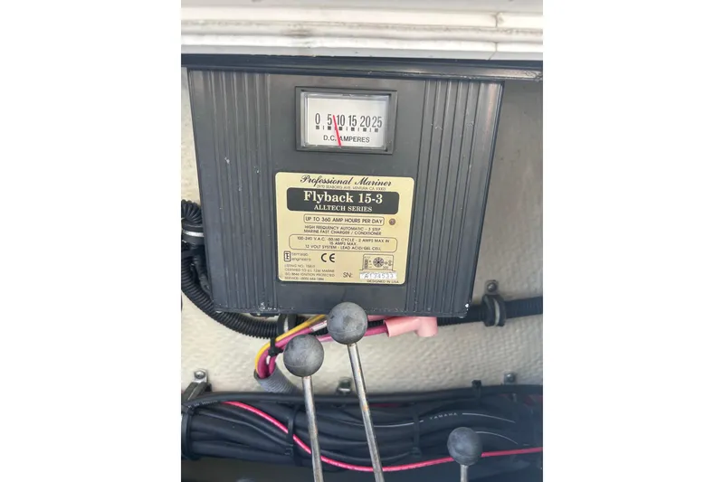 Slide: The Image of Electrical panel on a 2006 Wellcraft 290 Coastal boat, featuring Flyback 15-3 charger. - 34