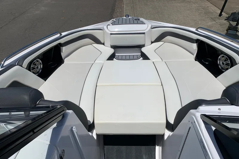 Slide: The Image of 2016 Yamaha Boats 242 Limited interior with white seating and sleek design. - 3