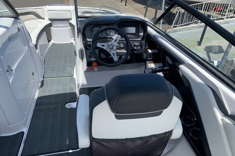 Slide: The Image of 2016 Yamaha Boats 242 Limited cockpit with steering wheel and seating area. - 4