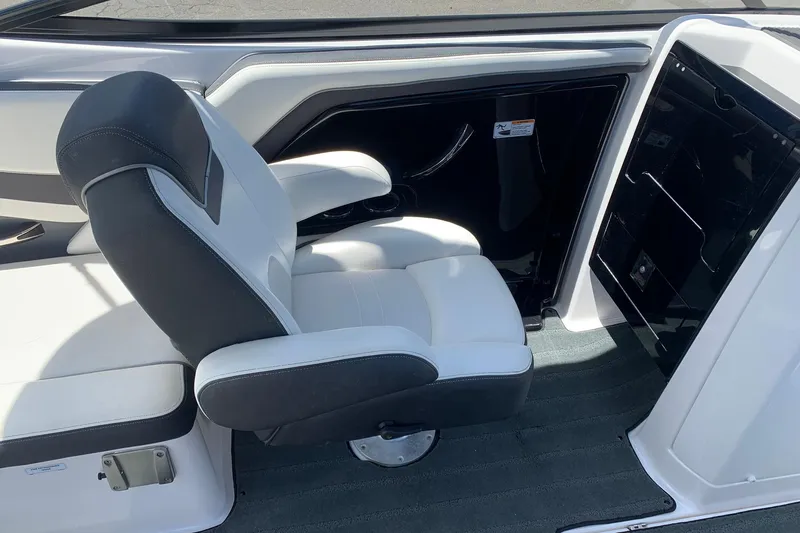 Slide: The Image of 2016 Yamaha Boats 242 Limited interior with white and black seating. - 6