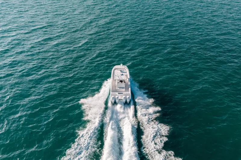 Slide: The Image of Aerial view of 2021 Invincible 37 Catamaran cruising on open water. - 10