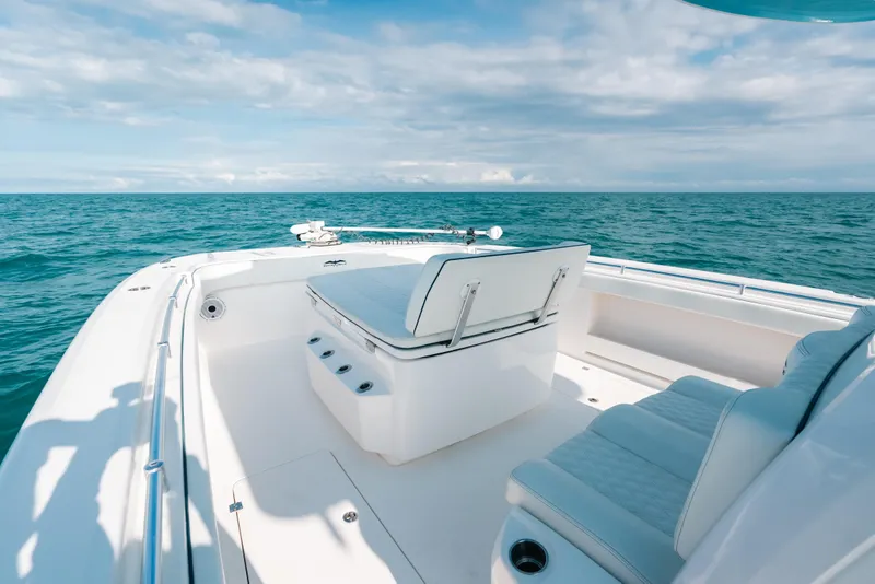 Slide: The Image of Invincible 37 Catamaran 2021 on open sea, featuring spacious seating and clear skies. - 13