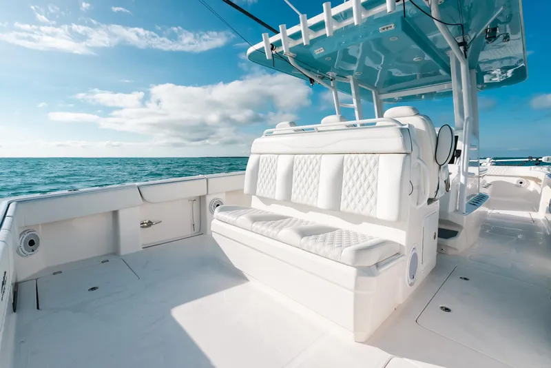 Slide: The Image of Invincible 37 Catamaran 2021 with luxurious seating, cruising on open ocean under blue sky. - 19