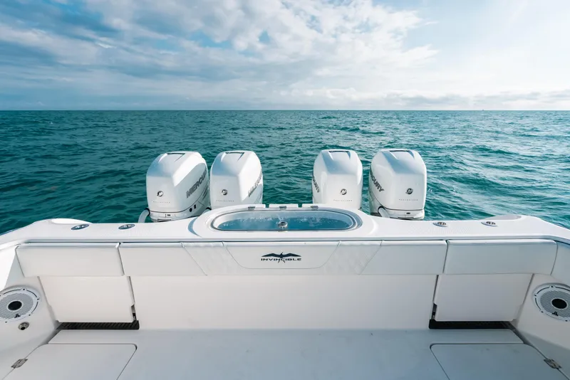 Slide: The Image of 2021 Invincible 37 Catamaran with four outboard engines on open sea. - 22