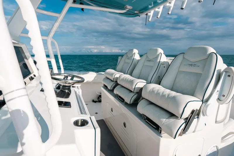 Slide: The Image of Luxurious seating on 2021 Invincible 37 Catamaran, featuring sleek design and ocean backdrop. - 24