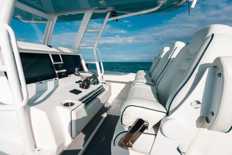 Slide: The Image of Luxurious interior of 2021 Invincible 37 Catamaran with modern helm and seating. - 25
