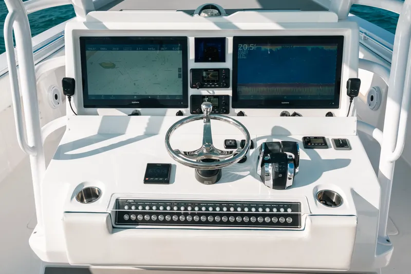Slide: The Image of Cockpit of 2021 Invincible 37 Catamaran with advanced navigation displays and controls. - 27