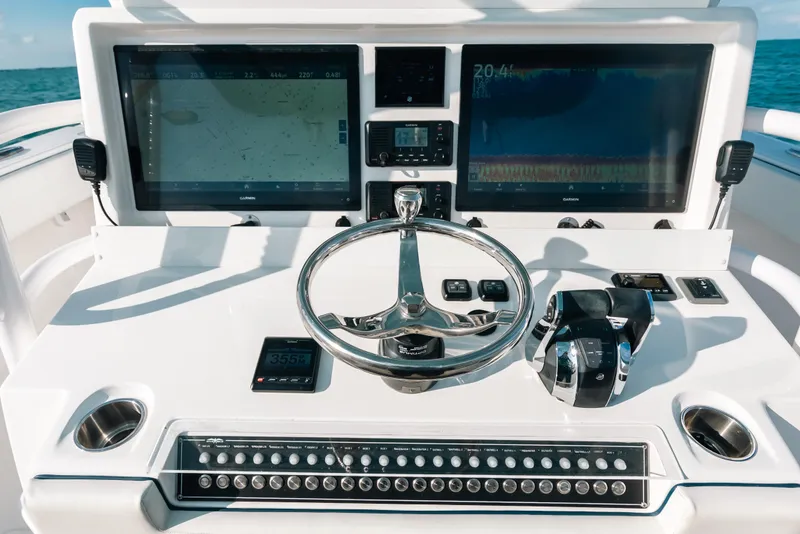 Slide: The Image of 2021 Invincible 37 Catamaran helm with dual displays and modern controls. - 29