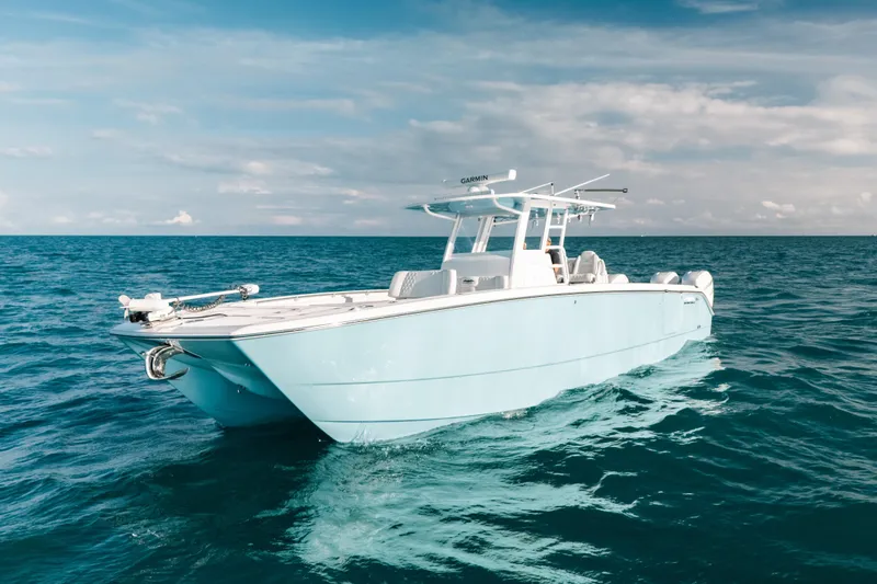 Slide: The Image of 2021 Invincible 37 Catamaran on open ocean under clear sky. - 3