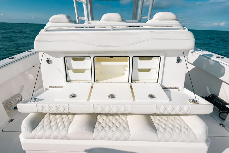Slide: The Image of Luxury seating and storage on 2021 Invincible 37 Catamaran, ocean backdrop. - 30