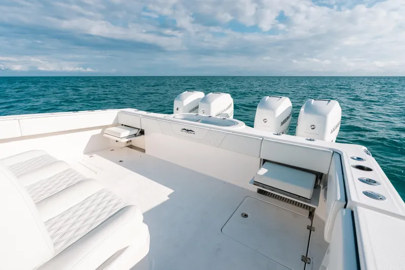 Slide: The Image of Invincible 37 Catamaran 2021 on open sea, featuring spacious deck and powerful engines. - 32