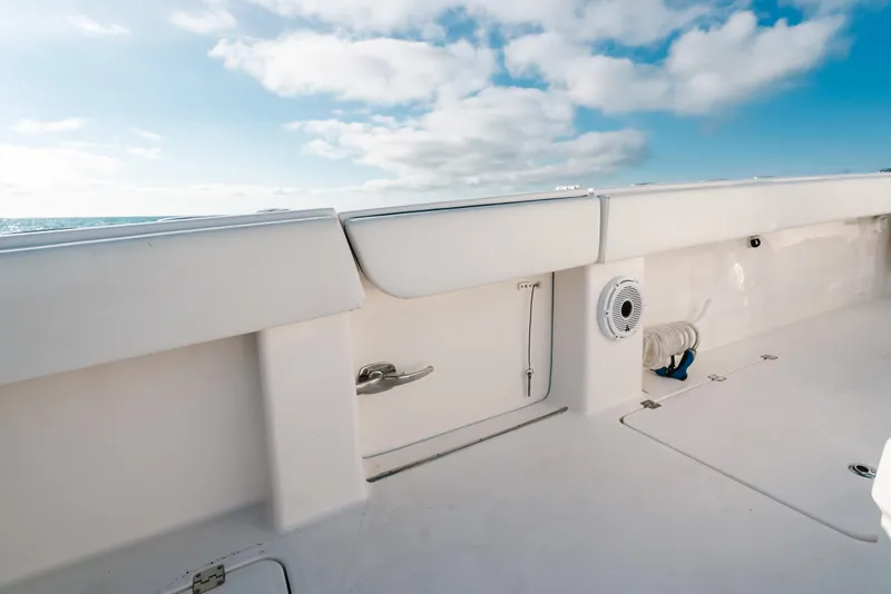 Slide: The Image of Invincible 37 Catamaran 2021 deck view with clear sky and ocean backdrop. - 40