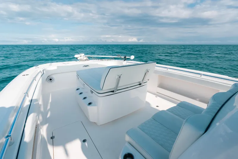 Slide: The Image of Invincible 37 Catamaran 2021 on open sea, featuring sleek white seating and clear blue waters. - 42