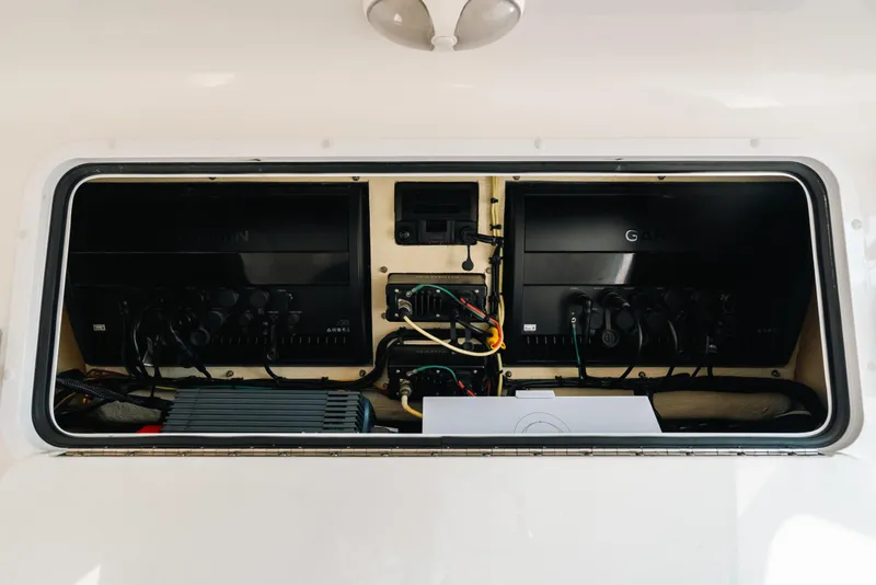 Slide: The Image of Electrical compartment of 2021 Invincible 37 Catamaran with Garmin equipment and wiring. - 49