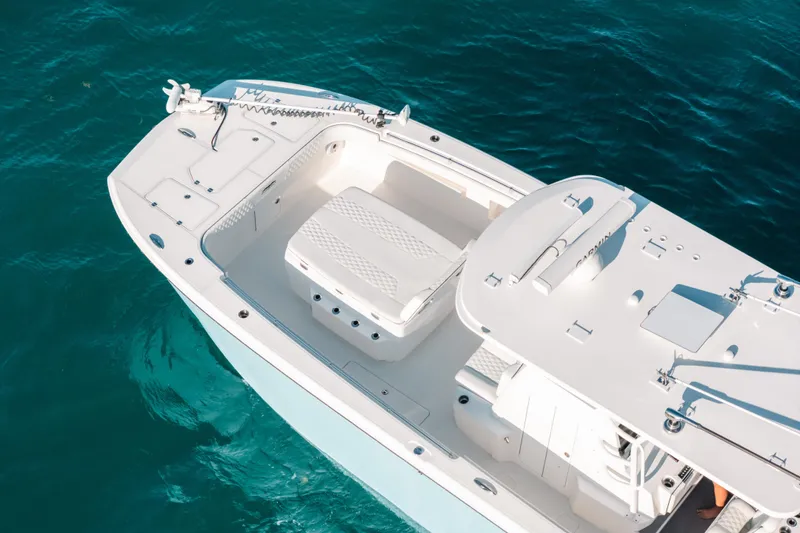 Slide: The Image of 2021 Invincible 37 Catamaran on clear blue water, aerial view. - 6