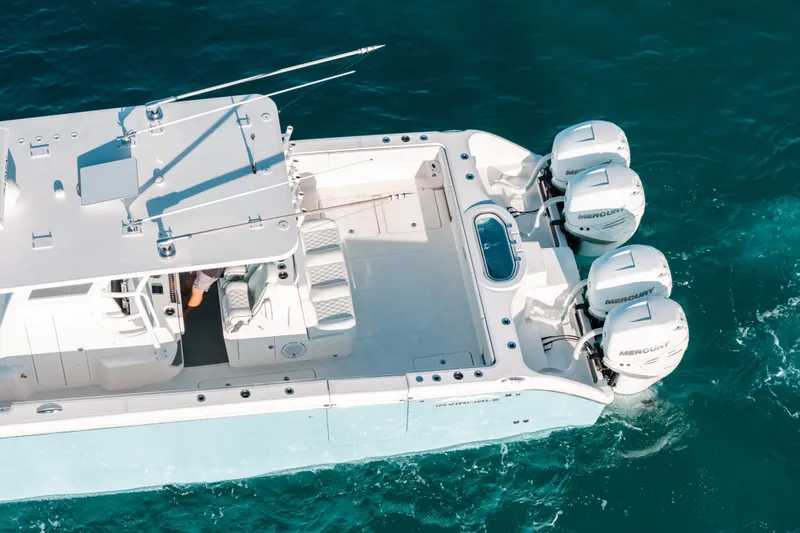 Slide: The Image of 2021 Invincible 37 Catamaran with four Mercury outboard engines on blue ocean water. - 7